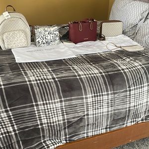 Gently used Michael Kors purses a backpack two crossbody bags an a tote